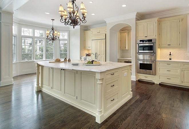 a modern kitchen with newly installed laminate floor in Olathe